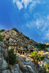 Wall Mural - Myra archaeological site with rock tombs in Demre, Turkey. The Ancient City of Myra is especially famous for its Lycian-Era rock tombs, Roman-Era theatre