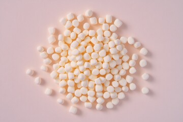 Poster - A pile of white marshmallows on a pink surface, great for food and dessert photography
