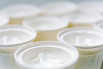 Poster - A group of yogurt cups sitting together, perfect for a snack or meal prep