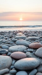 Wall Mural - Pebbles on beach at sunset creating relaxing atmosphere