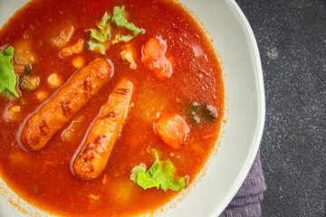 Wall Mural - Tomato soup with sausages fresh tasty food dish delicious gourmet food background on the table rustic food top view copy space