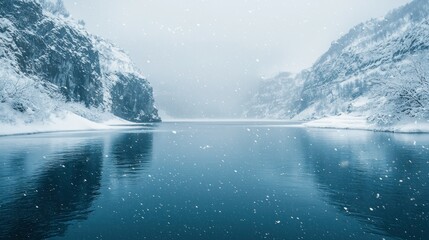 Wall Mural - Snowy mountain lake winter landscape; calm water, snowfall