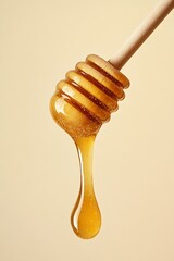 Poster - Golden honey dripping from a vintage wooden dipper against a soft light background : Generative AI