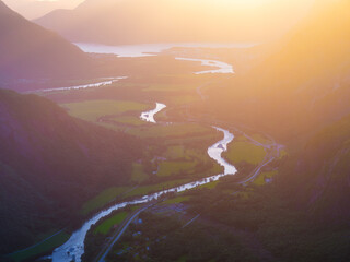 Wall Mural - nature in norway. panoramic view of wild norway. river among the rocks and mountains. bright sunshin