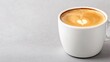 © tugkiara - White coffee cup with heart latte art on a gray surface. Possible use Stock photo for coffee shops, cafes, or food and beverage websites