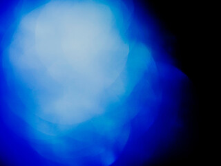 Wall Mural - blue color light leaks on dark background for design and special effects.