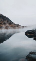 Poster - Serene hot spring with steam rising above rocky edges set in a tranquil landscape during a cloudy day. Generative AI