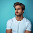 © Deja - Handsome man Turn sideways for skin care and cosmetics concept White shirt on blue background