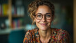 © Mykhailo Shvets - Warm and Friendly Caucasian Female Teacher Smiling in a Cozy Classroom or Library, Wearing Glasses and a Colorful Blouse, Creating an Engaging and Supportive Educational Atmosphere
