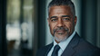 © Mykhailo Shvets - Confident African American Male Entrepreneur in a Stylish Suit Looking Professional and Successful in a Modern Business Environment with a Strong and Determined Expression