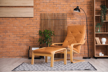 Wall Mural - Armchair with footrest, shelving unit, lamp and screen in interior of living room