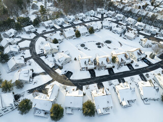 Wall Mural - aerial view of residential community in winter after snow