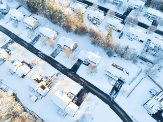 Wall Mural - aerial view of residential community in winter after snow under dusk sunlight