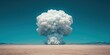 © narak0rn - A dramatic explosion forms a towering white cloud against a clear blue sky, set in a barren desert landscape.