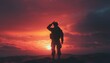 © riskun - Soldier silhouetted against a bright orange sunset saluting