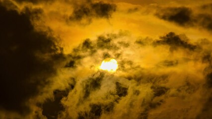 Wall Mural - timelapse of dramatic sunrise with orange sky in a cloudy day.