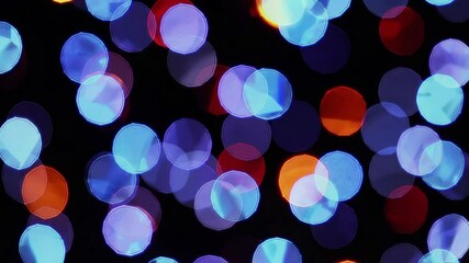 Poster - Bokeh light texture with blue and red circles against dark background, abstract pattern. Festive and artistic design concept