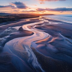 Poster - Serene coastal landscape featuring winding river meeting the sea at sunset creating a tranquil scene