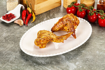 Wall Mural - Tasty roasted chicken wing with spices