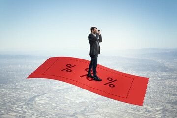 Aufkleber - Businessman standing on red discount ticket with binoculars, overlooking a cityscape in daylight. Concept of marketing and sales opportunity.