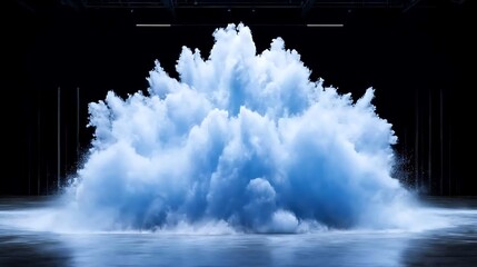 Poster - ethereal blue cloud bursting on a dark background in a dramatic and dreamlike presentation