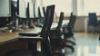 © Dai - Empty office desk with vacant chairs and monitors, symbolizing layoffs and workplace downsizing. Concept of job loss, corporate restructuring, and economic uncertainty in modern business environment.