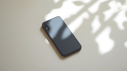 Poster - Smartphone on light surface with leaf shadows.  Possible use Product photography