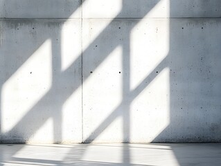 Poster - Concrete wall bathed in sunlight creating geometric shadows in a modern architectural space