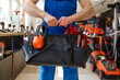 © Nomad_Soul - Cropped shot of repairman or construction worker carrying toolbox handbag