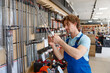 © Nomad_Soul - Man worker buying drill consumable tool to make holes in concrete at tools shop