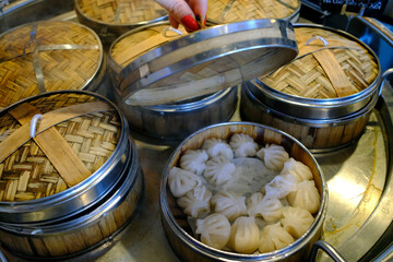 Wall Mural - Dim sum and dumpling  buffet in a restaurant. Steamer baskets.