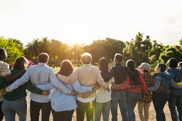 group of multi generational people hugging each others - support, multiracial, empowering and divers