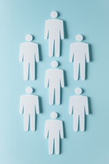 Poster - Stylized figures arranged in a geometric pattern on a blue background, representing teamwork, collaboration, and diversity.