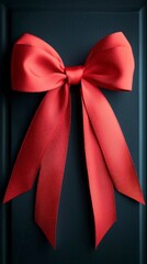 Wall Mural - Red Satin Bow on Dark Background