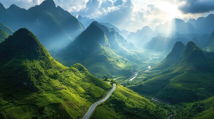 Poster - A tranquil mountain highway winding through lush green hills, with sunlight breaking through the clouds and highlighting the peaceful landscape