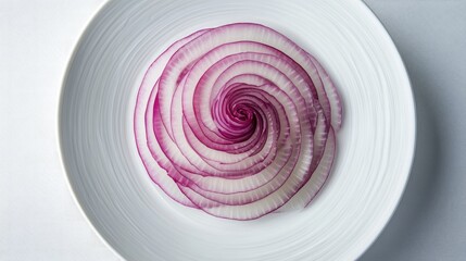 Poster - Thin slices of red onion arranged in concentric circles on a white ceramic plate, showcasing their vivid color and delicate texture