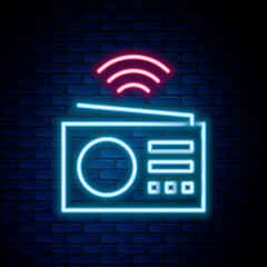 Fototapete - Glowing neon line Smart radio system icon isolated on brick wall background. Internet of things concept with wireless connection. Colorful outline concept. Vector