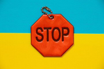 Flag of Ukraine and reflective keychain with text stop