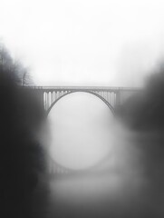 Aufkleber - A misty scene featuring a large arch bridge partially obscured by fog, creating a serene and mysterious atmosphere.