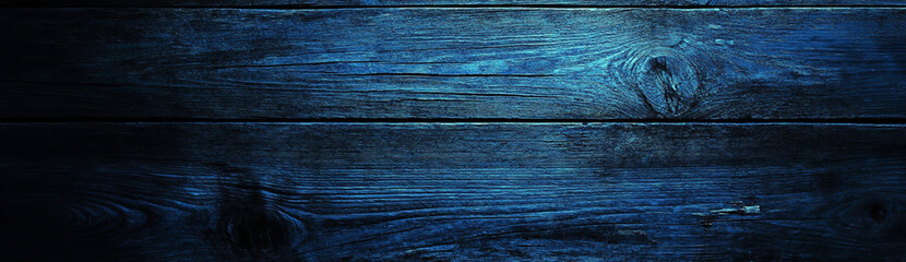 dark blue wooden background with the texture of old wood planks, a banner design. abstract backdrop 