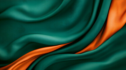 Poster - A close-up of smooth silk fabric in rich green and vibrant orange, showcasing elegant curves and textures for creative designs.