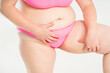 © staras - Overweight woman, fat thighs and legs, obesity female body with cellulite on gray background