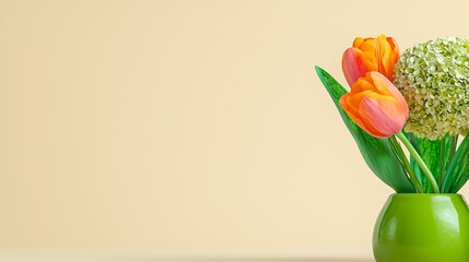 Canvas Print - A vibrant arrangement of orange and pink tulips with green leaves in a simple vase against a soft backdrop