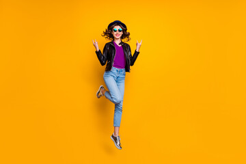 Wall Mural - full length photo of cheerful girl with curly hairstyle jump show horned sign rock on pank concert w