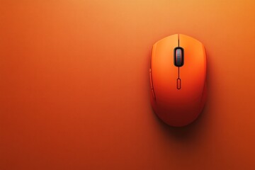 Fototapete - An orange computer mouse rests in a top view perspective on a monochromatic orange surface, emphasizing its sleek and contemporary design