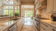 © Aulia - Luxurious modern kitchen with open view of backyard