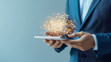 Poster - A person in a suit holds a tablet, emanating sparkling magical effects, symbolizing innovation and technology.