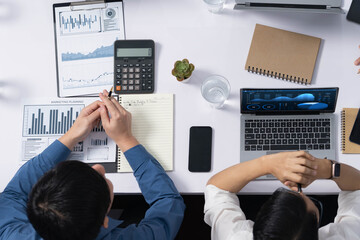 Poster - Diverse corporate audit team or company bookkeeper and accountant consultant calculate account expenses and income budget for tax refunds using calculators in top view busy workspace. Prudent