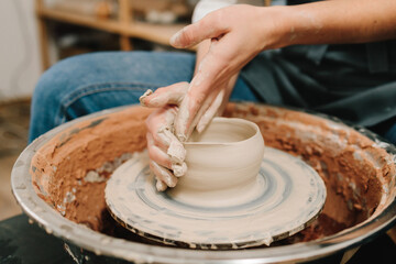 Poster - Potter creates a ceramic bowl in the pottery studio. Process of making a unique ceramic shape.