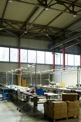 Aufkleber - Long tables with variety of working equipment for producing new items in spacious workshop of modern factory